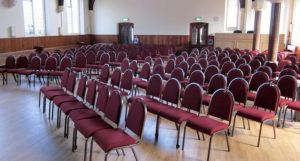 Lightweight stacking aluminium chairs with upholstered seats and back rests from Alpha Furnishing